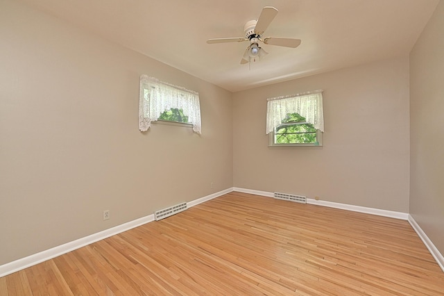 619 9th Ave, Grand Rapids, MN 55744 - empty room featuring baseboards, light wood-style floors, and a ceiling fan