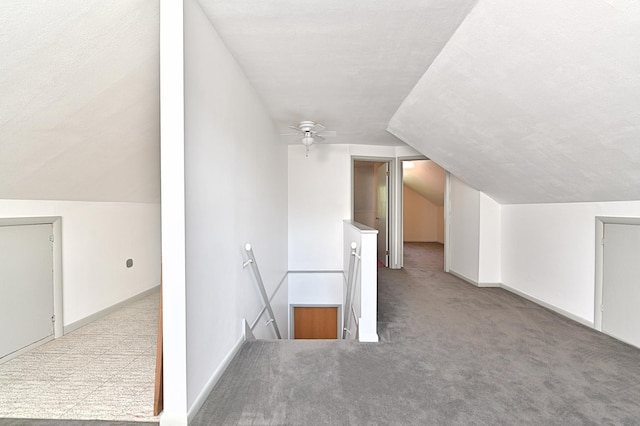 619 9th Ave, Grand Rapids, MN 55744 - additional living space with carpet flooring, lofted ceiling, baseboards, and ceiling fan