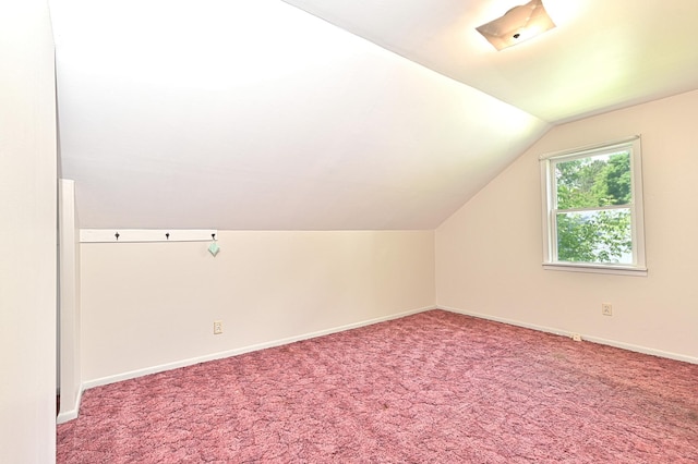 619 9th Ave, Grand Rapids, MN 55744 - bonus room featuring lofted ceiling, baseboards, and carpet flooring