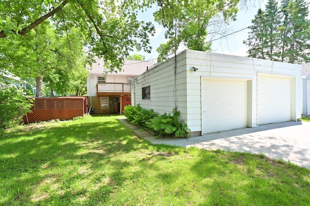 619 9th Ave, Grand Rapids, MN 55744 - view of yard featuring a garage