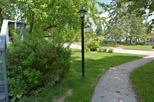 619 9th Ave, Grand Rapids, MN 55744 - surrounding community with a lawn