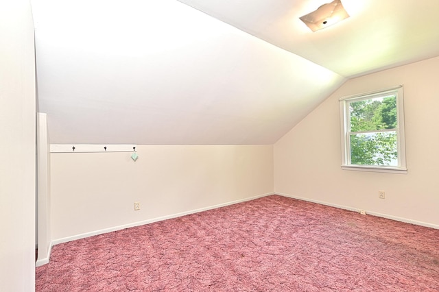 619 9th Ave, Grand Rapids, MN 55744 - additional living space with lofted ceiling, baseboards, and carpet