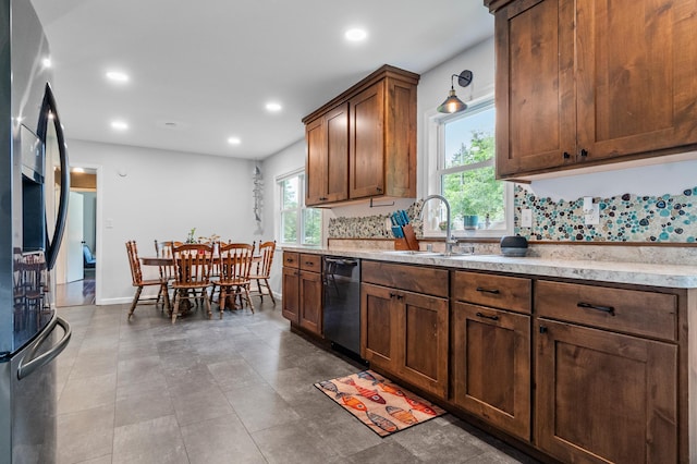 712 Shady Ln SW, Alexandria, MN 56308 - kitchen with dishwasher, fridge with ice dispenser, recessed lighting, and light stone countertops