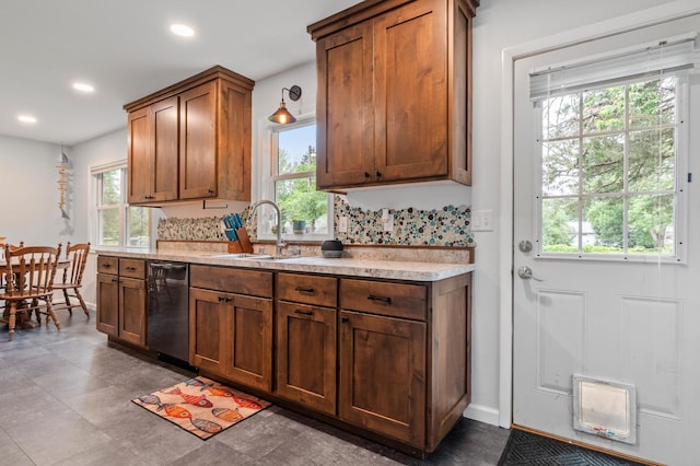 712 Shady Ln SW, Alexandria, MN 56308 - kitchen with dishwasher, healthy amount of natural light, light countertops, and recessed lighting