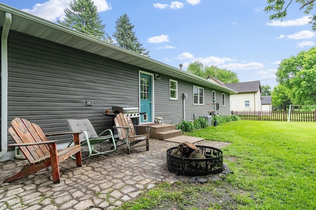 712 Shady Ln SW, Alexandria, MN 56308 - rear view of house featuring a fire pit and a patio area