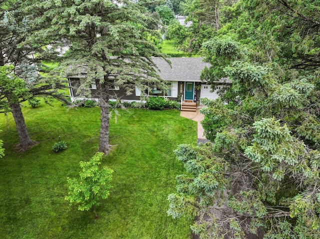 712 Shady Ln SW, Alexandria, MN 56308 - view of front of home featuring a front lawn, roof with shingles, and an attached garage