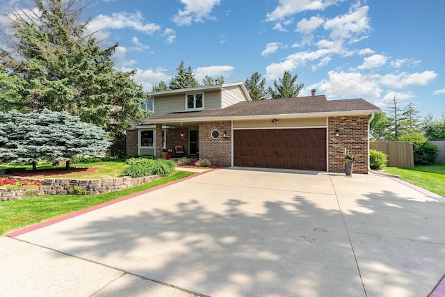 4078 153rd St W, Rosemount, MN 55068 - traditional-style house featuring a garage, brick siding, and concrete driveway
