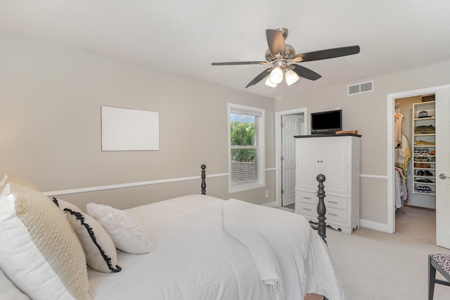 4078 153rd St W, Rosemount, MN 55068 - bedroom with a walk in closet, light carpet, a ceiling fan, and a closet