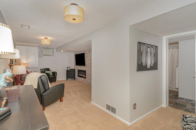 4078 153rd St W, Rosemount, MN 55068 - living room featuring light carpet, a textured ceiling, and a large fireplace