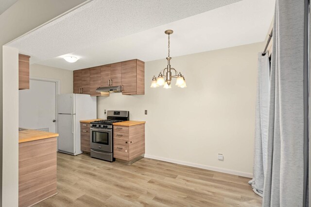 2783 Upland Ct, Plymouth, MN 55447 - kitchen featuring gas stove, butcher block countertops, freestanding refrigerator, under cabinet range hood, and light wood finished floors