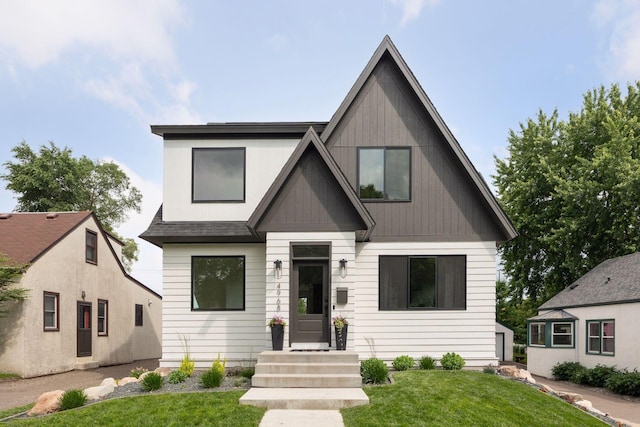 4968 40th St, Saint Louis Park, MN 55416 - view of front facade with a front lawn and board and batten siding