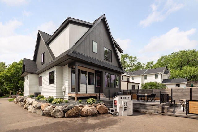 4968 40th St, Saint Louis Park, MN 55416 - contemporary home featuring a shingled roof and a patio area