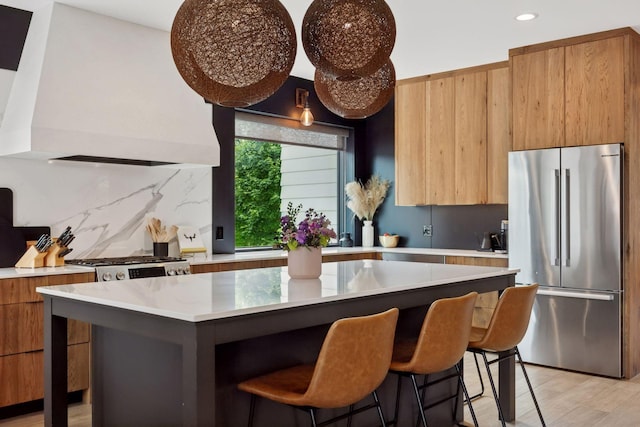 4968 40th St, Saint Louis Park, MN 55416 - kitchen featuring freestanding refrigerator, modern cabinets, wall chimney range hood, recessed lighting, and light countertops