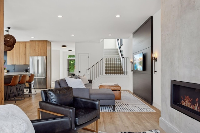 4968 40th St, Saint Louis Park, MN 55416 - living area featuring light wood-style floors, stairs, recessed lighting, and a large fireplace