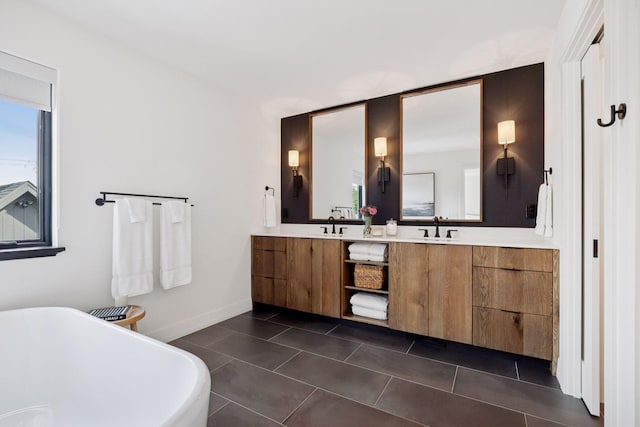 4968 40th St, Saint Louis Park, MN 55416 - bathroom featuring a soaking tub, double vanity, and tile patterned flooring