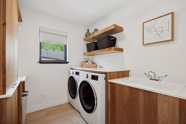 4968 40th St, Saint Louis Park, MN 55416 - laundry area with washer and clothes dryer and light wood finished floors