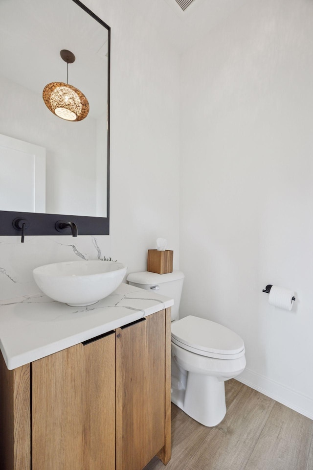 4968 40th St, Saint Louis Park, MN 55416 - half bath featuring wood finished floors and vanity