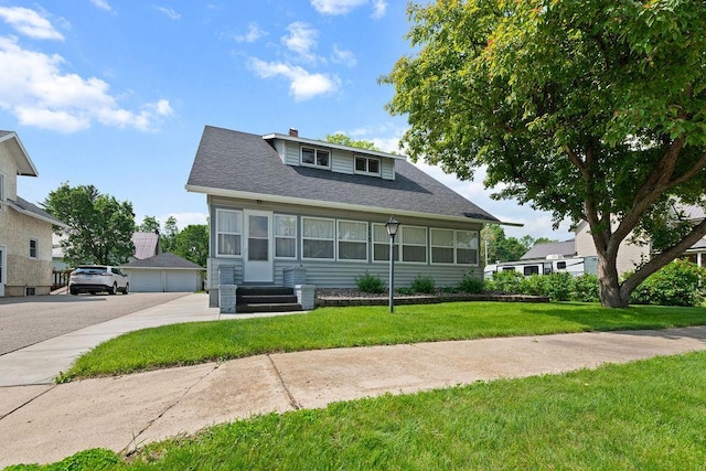 115 Spruce St W, Grey Eagle, MN 56336 - bungalow-style house featuring a front yard, a garage, a shingled roof, and a chimney