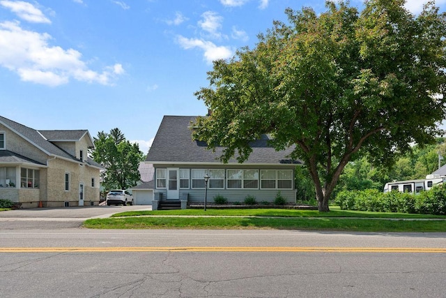 115 Spruce St W, Grey Eagle, MN 56336 - view of front of house featuring driveway, a front yard, and a garage
