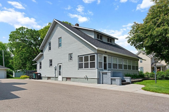 115 Spruce St W, Grey Eagle, MN 56336 - view of side of property featuring a chimney and roof with shingles