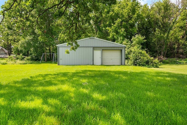 115 Spruce St W, Grey Eagle, MN 56336 - view of green lawn with a garage, an outbuilding, and a pole building