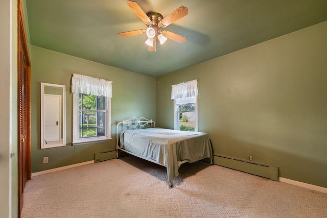 115 Spruce St W, Grey Eagle, MN 56336 - carpeted bedroom with a baseboard radiator and ceiling fan