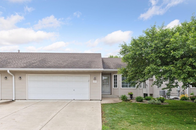 1040 Primrose Ln, Waconia, MN 55387 - view of front facade with an attached garage, concrete driveway, a front yard, and roof with shingles