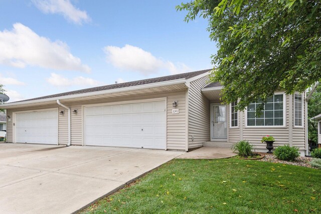 1040 Primrose Ln, Waconia, MN 55387 - ranch-style home featuring driveway, a front yard, and an attached garage