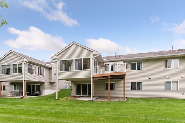1040 Primrose Ln, Waconia, MN 55387 - rear view of house featuring a sunroom, a patio, and a yard