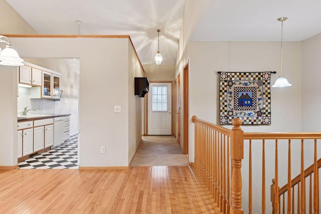 1040 Primrose Ln, Waconia, MN 55387 - hall with light wood finished floors and an upstairs landing
