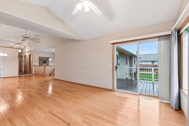 1040 Primrose Ln, Waconia, MN 55387 - unfurnished living room with a ceiling fan, light wood-style floors, high vaulted ceiling, and a chandelier
