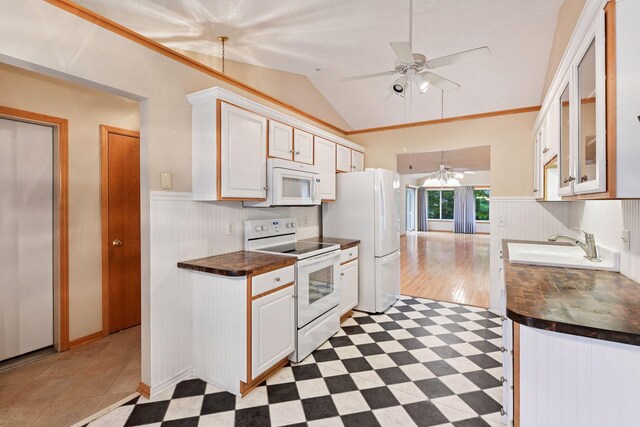 1040 Primrose Ln, Waconia, MN 55387 - kitchen featuring white appliances, a ceiling fan, a wainscoted wall, lofted ceiling, and tile patterned floors