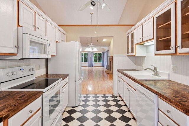 1040 Primrose Ln, Waconia, MN 55387 - kitchen with white appliances, a ceiling fan, light floors, wooden counters, and wainscoting