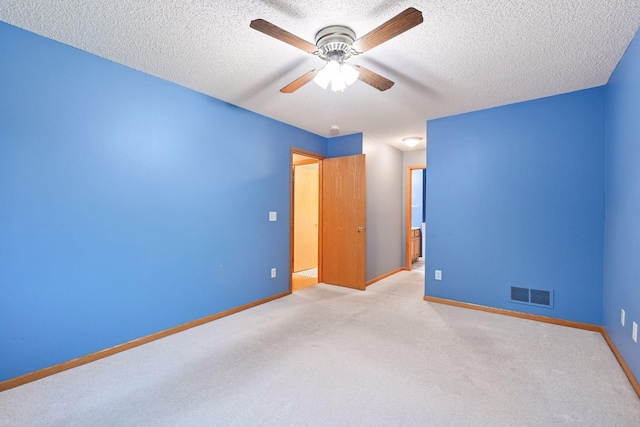 1040 Primrose Ln, Waconia, MN 55387 - unfurnished bedroom featuring light carpet, a textured ceiling, and a ceiling fan