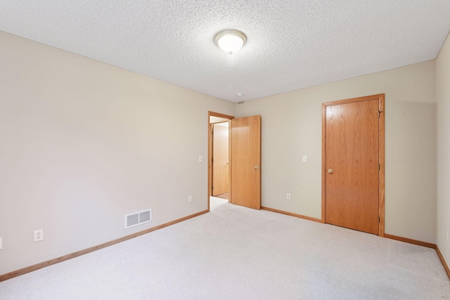 1040 Primrose Ln, Waconia, MN 55387 - unfurnished bedroom with carpet flooring and a textured ceiling