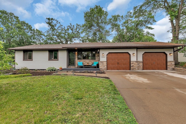 12940 8th Ave N, Zimmerman, MN 55398 - view of front of house with concrete driveway, a front yard, an attached garage, and stone siding