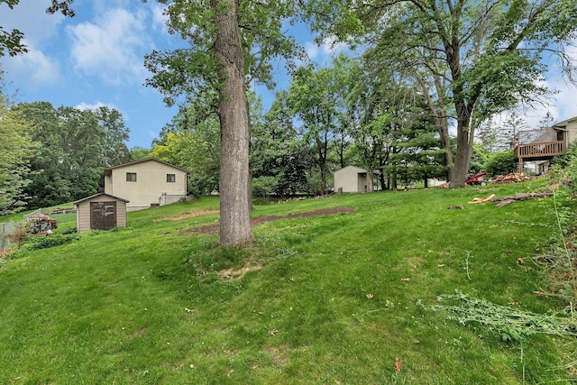12940 8th Ave N, Zimmerman, MN 55398 - view of grassy yard featuring a storage unit and view of wooded area