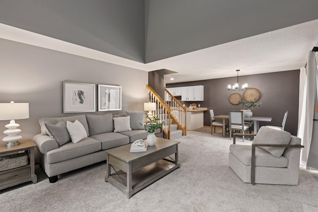5425 Fawn Ct SE, Prior Lake, MN 55372 - living room with light colored carpet, stairway, and a chandelier