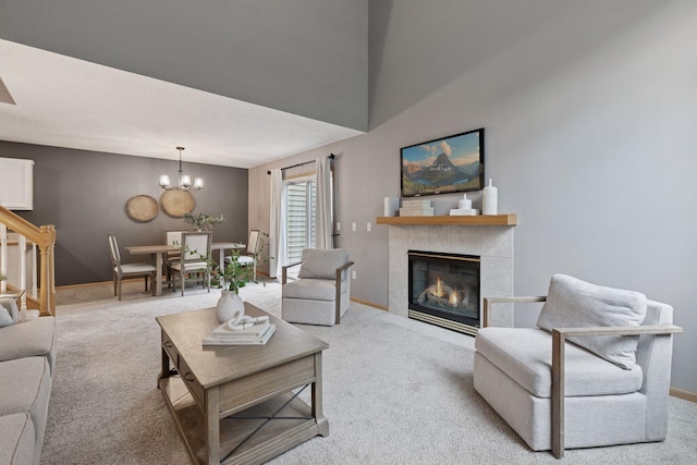5425 Fawn Ct SE, Prior Lake, MN 55372 - carpeted living room featuring a chandelier, a fireplace, and stairs