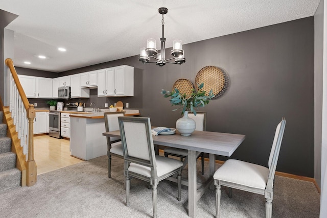 5425 Fawn Ct SE, Prior Lake, MN 55372 - dining area featuring a chandelier, stairway, light carpet, recessed lighting, and a textured ceiling
