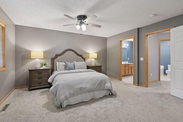 5425 Fawn Ct SE, Prior Lake, MN 55372 - carpeted bedroom featuring ensuite bathroom, a textured ceiling, and a ceiling fan