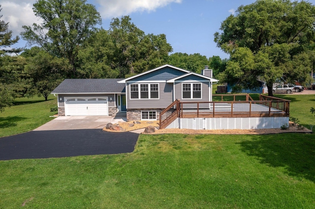13912 80th St NE, Otsego, MN 55330 - view of front facade with a chimney, stone siding, an attached garage, asphalt driveway, and a front yard