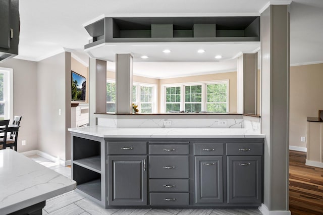 13912 80th St NE, Otsego, MN 55330 - kitchen with crown molding, gray cabinetry, baseboards, light stone countertops, and open shelves