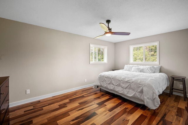13912 80th St NE, Otsego, MN 55330 - bedroom featuring baseboards, wood finished floors, and ceiling fan