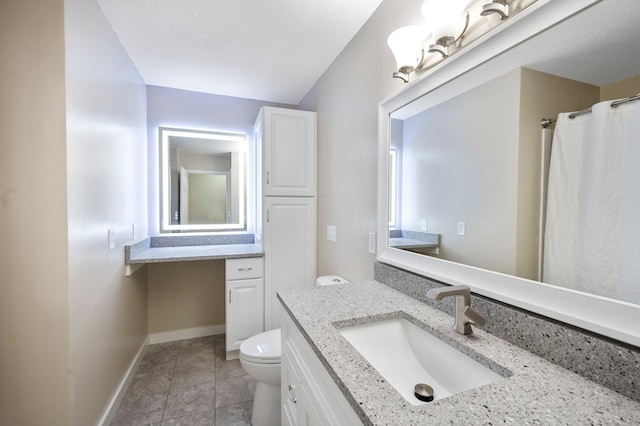 13912 80th St NE, Otsego, MN 55330 - bathroom with toilet, vanity, tile patterned flooring, and baseboards