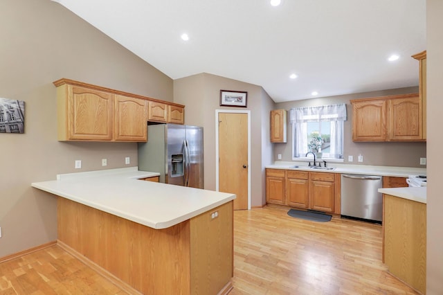1310 Widgeon Way, Buffalo, MN 55313 - kitchen featuring stainless steel appliances, vaulted ceiling, a peninsula, light wood-style flooring, and recessed lighting