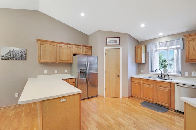 1310 Widgeon Way, Buffalo, MN 55313 - kitchen featuring stainless steel appliances, a peninsula, lofted ceiling, light wood-type flooring, and light countertops