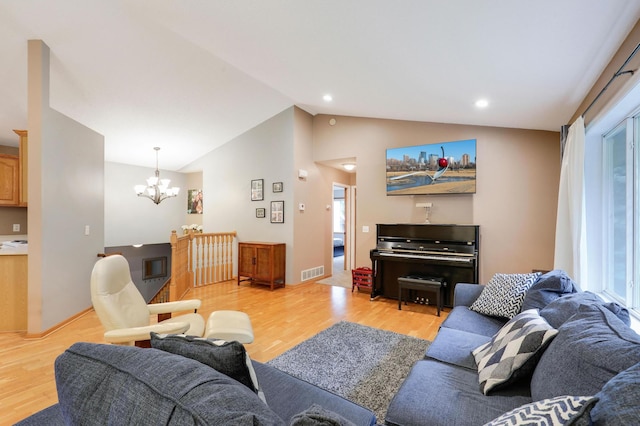 1310 Widgeon Way, Buffalo, MN 55313 - living area with a chandelier, light wood-type flooring, and lofted ceiling