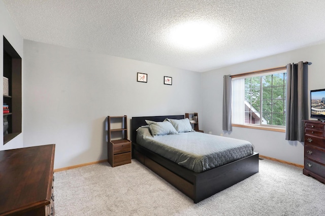 1310 Widgeon Way, Buffalo, MN 55313 - carpeted bedroom with a textured ceiling and baseboards