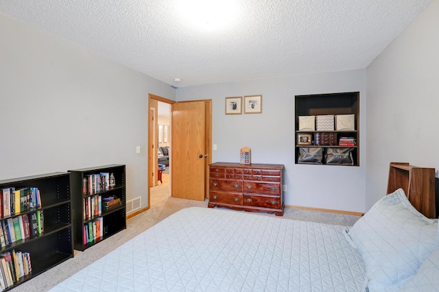 1310 Widgeon Way, Buffalo, MN 55313 - carpeted bedroom with a textured ceiling and baseboards